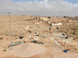 Berber village Tamezret Gabes province mosque hot desert of North Africa in Tunisia.