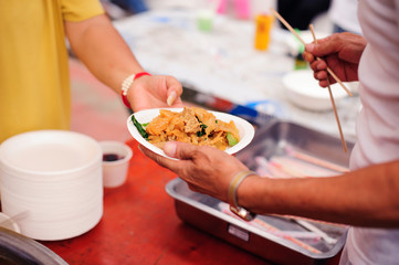 Hands of beggars accepting food from the hands of volunteers who come to help free food breaks : Social Problems of Poverty Helped by Feeding