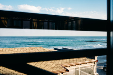 View through the window to blue sea