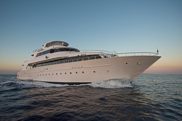Luxury private motor yacht sailing at sea