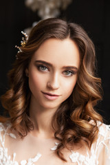 Fototapeta premium Wedding. Perfect fashion model woman with beautiful hairstyle. Elegant hair accessorie. Studio indoor photo. 