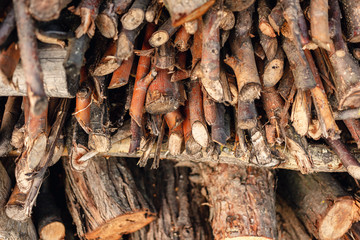 Preparation of firewood for the winter. Firewood background. Stacks of firewood.
