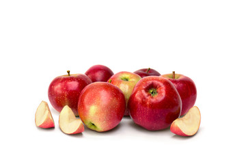 Ripe red juicy apples with slices apples on a white background