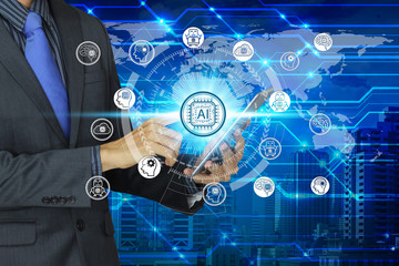 Businessman use tablet with virtual screen Artificial Intelligence technology icon over the Network connection, Artificial Intelligence Technology Concept.