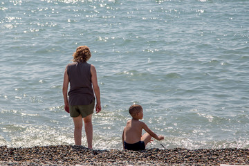 Fototapeta na wymiar mother with son at the seaside