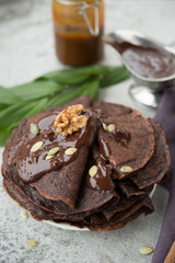 Chocolate pancakes for Breakfast with hot chocolate.Selective focus.