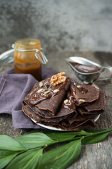 Chocolate pancakes for Breakfast with hot chocolate.Selective focus.