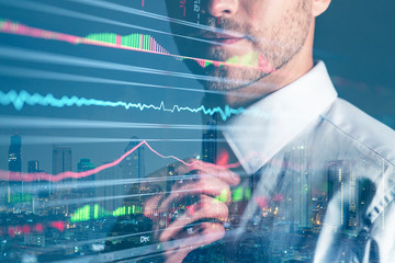 executive smart caucasian businessman  trade and invest in stock market doubke exposure with financial stock chart business ideas concept