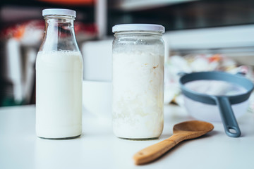 Strained kefir grains in mason jars.