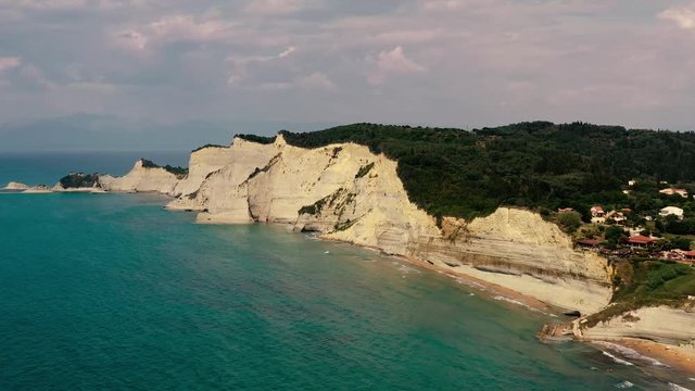4K aerial view of Logas beach cliffs in Peroulades