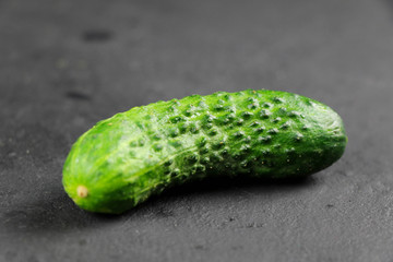 fresh cucumber on gray background