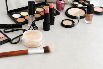 Makeup products, decorative cosmetics on grey background  flat lay.  Fashion and beauty concept....