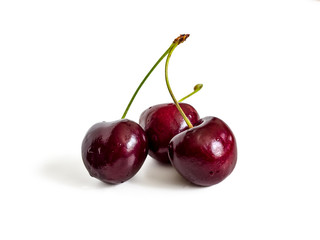 Three sweet cherry on white background