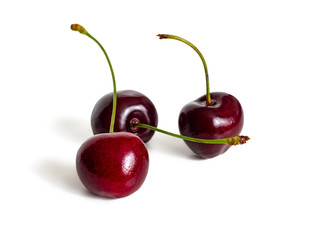 Three cherry berries on a white background