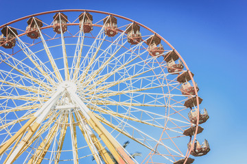 Ferris wheel in an amusement park at summer