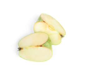 Pieces of fresh green apple on white background, top view
