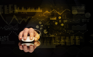 Hand using wireless mouse with financial concept on dark background