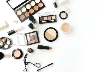 Makeup products, decorative cosmetics on white background  flat lay .  Fashion and beauty concept. Top view. Copy space.