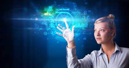 Woman touching hologram screen displaying medical symbols and charts