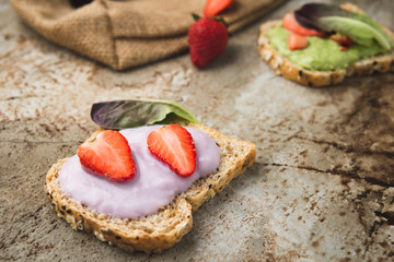 Bread wholegrain mashed avocado and blueberry with strawberry