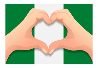 Fototapeta premium Nigeria flag and hand heart shape