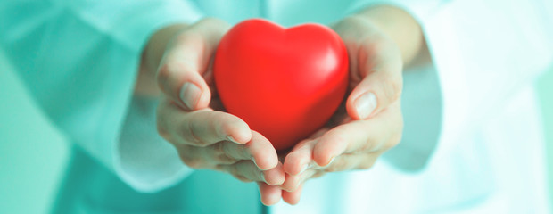  Holding red heart shape in hand