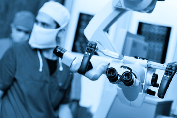 surgical microscope on the background of modern neurosurgical operating room and doctors