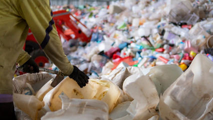 Workers are waste separation in the garbage factory