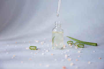 Dropper glass bottle with pipette. Mock up Essential liquid with aloe vera