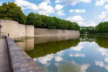Fototapeta na wymiar Wall and moat around town of Ypres, Ieper, Belgium