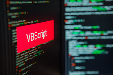 Programming language, VBScript inscription on the background of computer code.