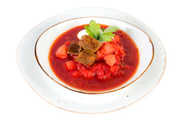 Traditional Ukrainian borscht with beef and sour cream isolated on white background