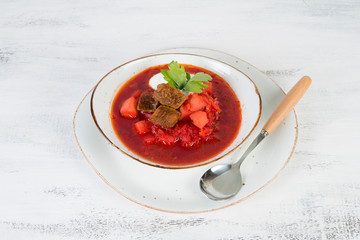 Traditional Ukrainian borsch with beef and sour cream