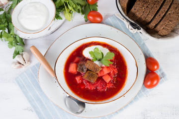 Traditional Ukrainian borsch with beef and sour cream