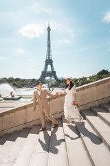 Pre-wedding shoot of young Asian couple in Paris, France during summer time.