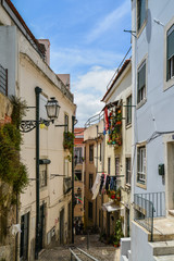 Fototapeta na wymiar Traditional street with staircase in Alfama