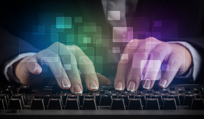 Business woman typing on keyboard with colorful concept