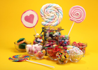 candies with jelly and sugar. colorful array of different childs sweets and treats.