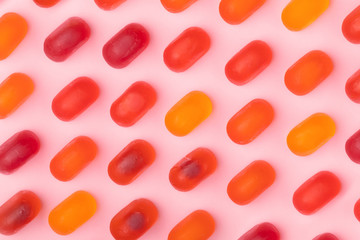 colorful chewy candy pattern over pink background
