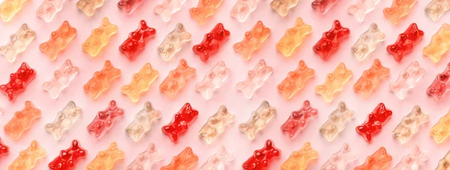  Flat lay composition with delicious jelly bears, jelly bears pattern on pink background, panoramic image © alesmunt