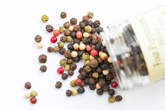 Peppercorns Spilled from a Spice Jar