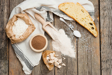 slice of bread and ingredients on old weathered wooden table