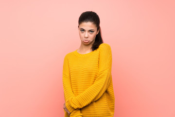 Fototapeta premium Teenager girl over isolated pink wall with sad and depressed expression