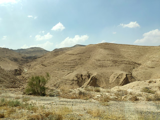 Desert land landscape with rocks, hills and mountains