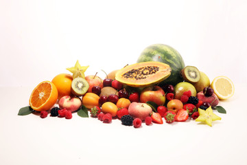 Fresh summer fruits with apple, peach, papaya, berries, pear and apricot.