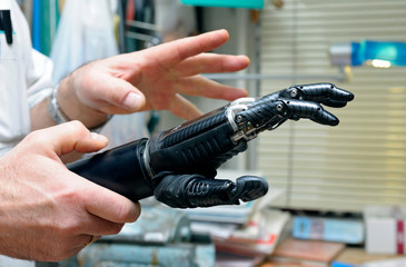 Podiatrist's hands holding a new artificial limb