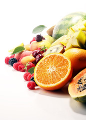 Fresh summer fruits with apple, peach, papaya, berries, pear and apricot.