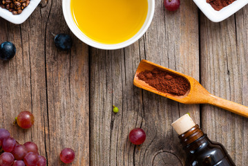 grape seed oil, grist and bunches on old wood