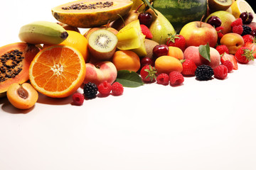Fresh summer fruits with apple, peach, papaya, berries, pear and apricot.