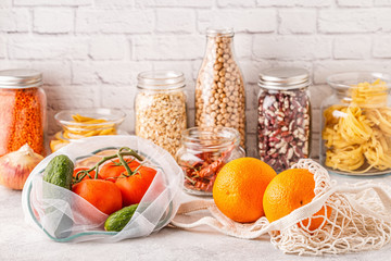 Products in textile bags, glassware. Eco friendly shopping and food storage.